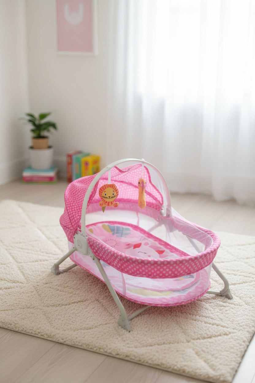 Pink baby bassinet front view showing rocker base