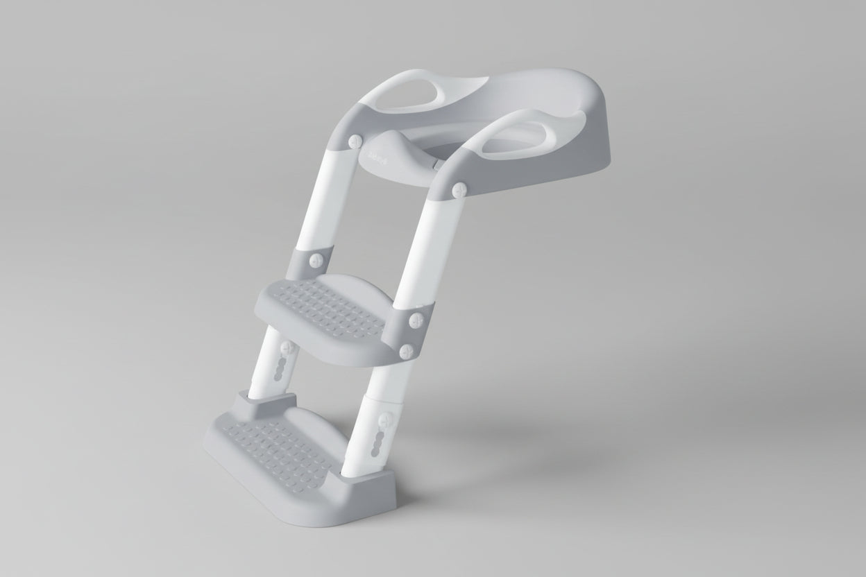 Children's toilet seat with step stool attached to a toilet on floor.